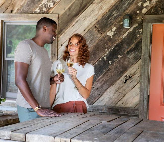 a couple enjoying glasses of wine